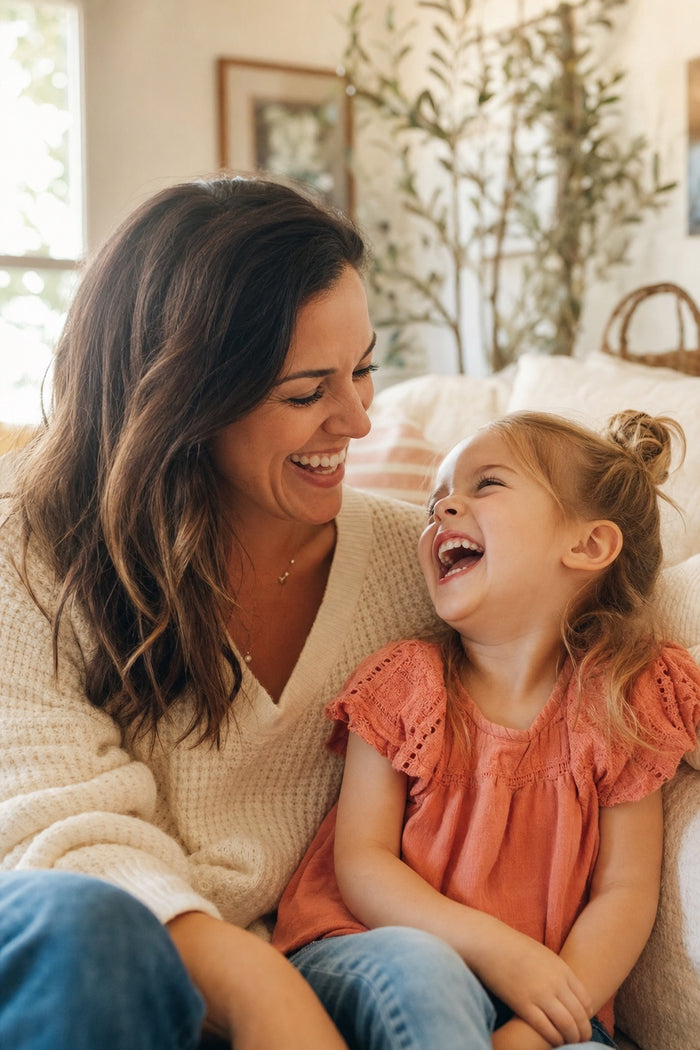 A mother and daughter laughing together